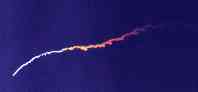 Photo of M-II launch, second stage, rainbow exhaust (by Bryan Rhrenbacher)